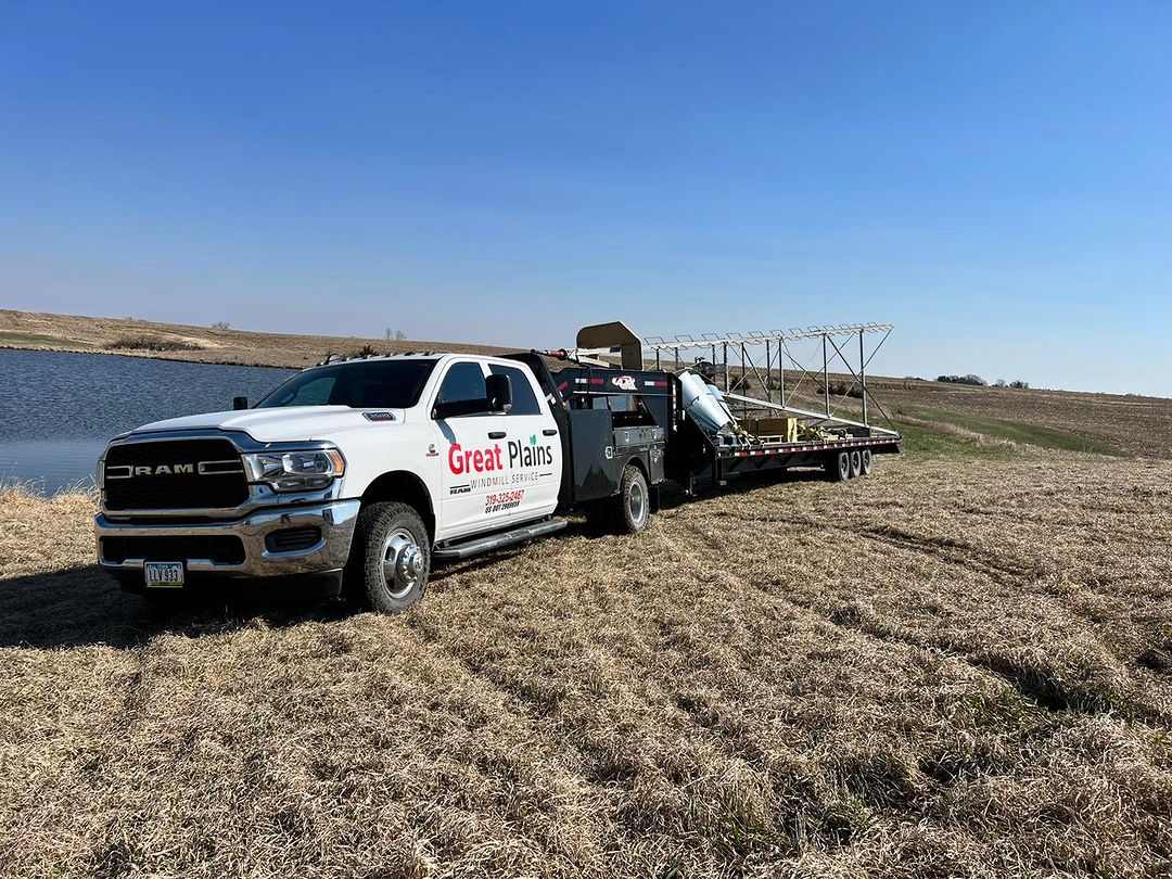 Great Plains Truck | Great Plains Windmill Service Great Plains Truck in a field installing a new windmill